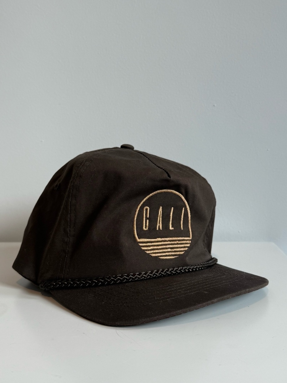 CALI Embroidered Rope-Trim Cap in Black & Gold